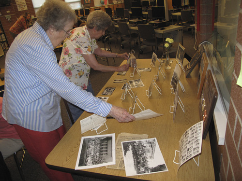 Brennan Smith  |  The Salt Lake Tribune
Carol Watts and Marge Sowby view a collection of historic Hawthorne Elementary photos for the school's centennial celebration.